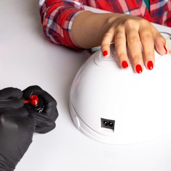 front-view-young-female-manicure-with-black-gloves-doing-manicure-white (1)